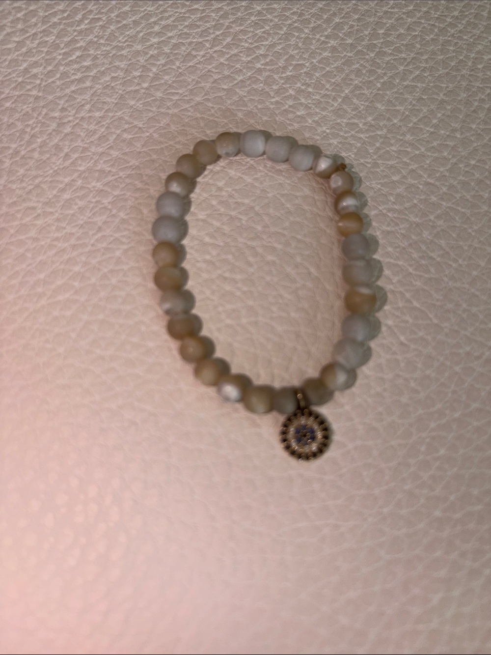 Beige Matte Beaded Stretch Bracelet with Sunburst Pendant
